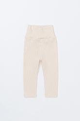 Flat lay of Avauma Aileen Baby Leggings in Butter Cream, soft ribbed baby leggings with high-waist design for extra comfort.